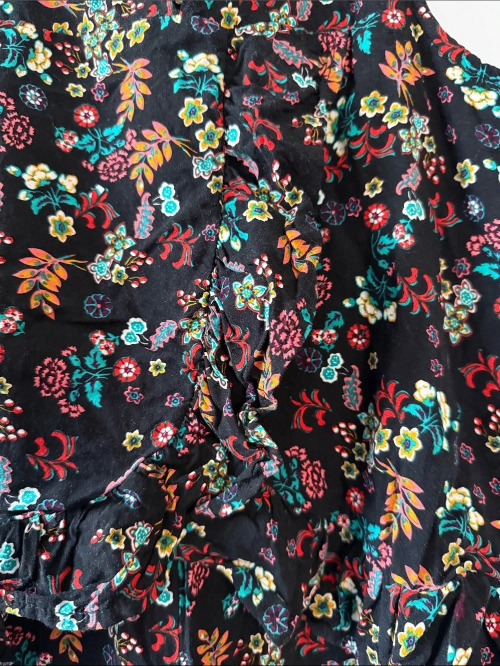 Gently worn Black Floral Ruffled Waist Sleeveless Romper
